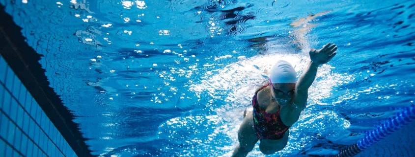 Fit female athlete swimming in pool